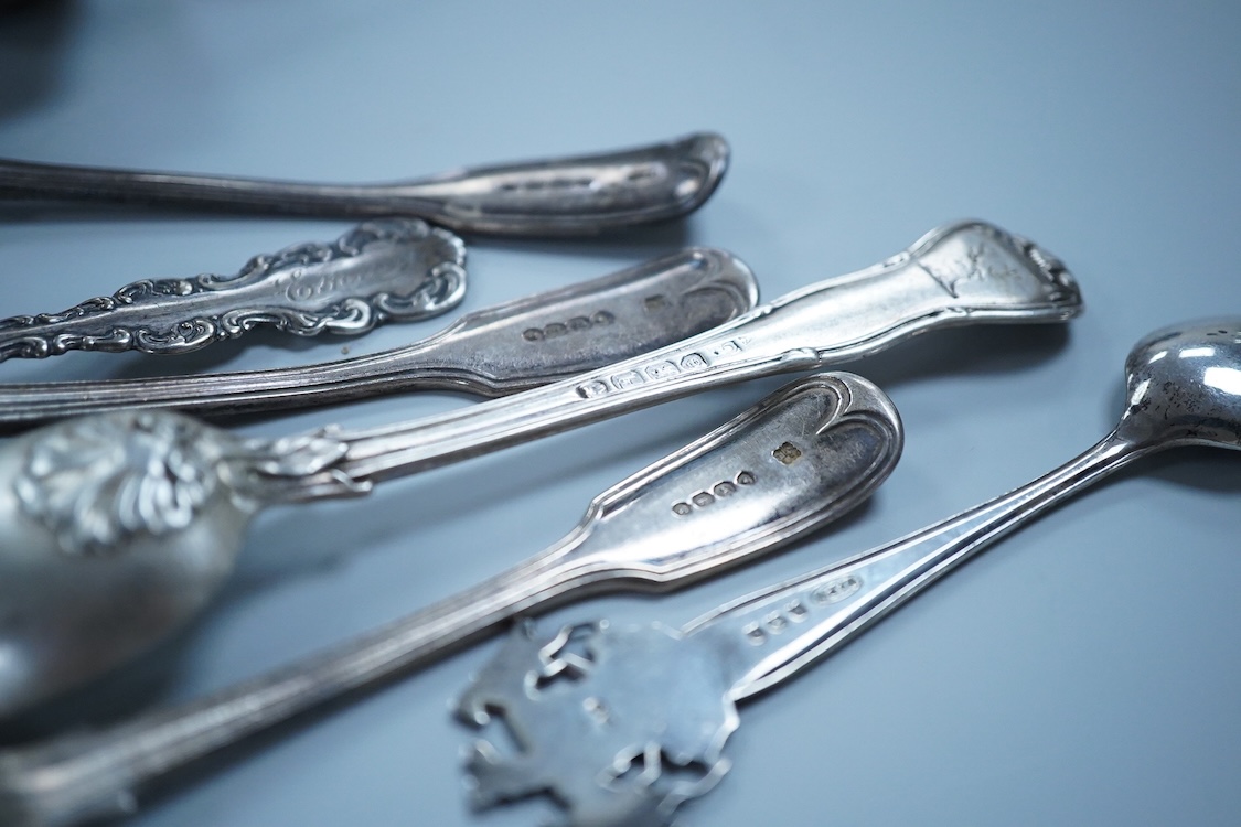 A small quantity of assorted 19th century and later silver and white metal flatware, including teaspoons, commemorative spoons, ladles, sugar tongs, pickle fork, a pair of Swedish salad serves, a similar butter knife and